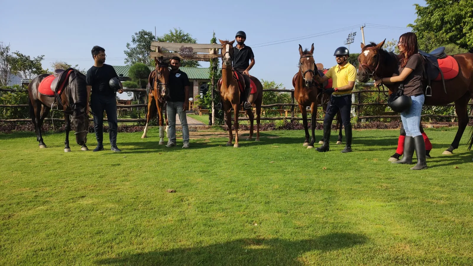 A group of riders meeting in the FHRC arena.